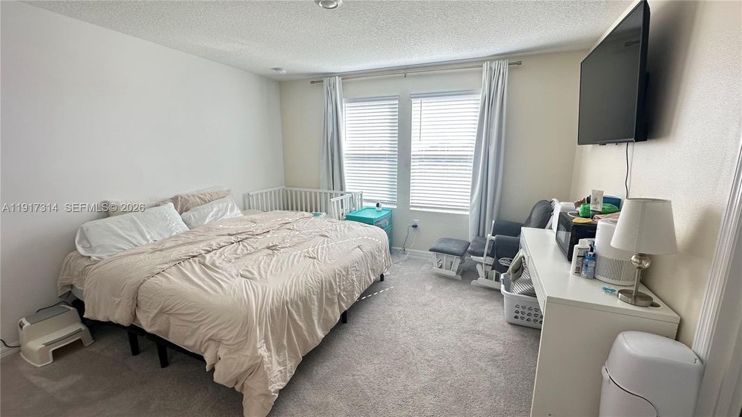 Furnished interior view inside a new home in The Townhomes at Bellalago, Kissimmee (Image 9).