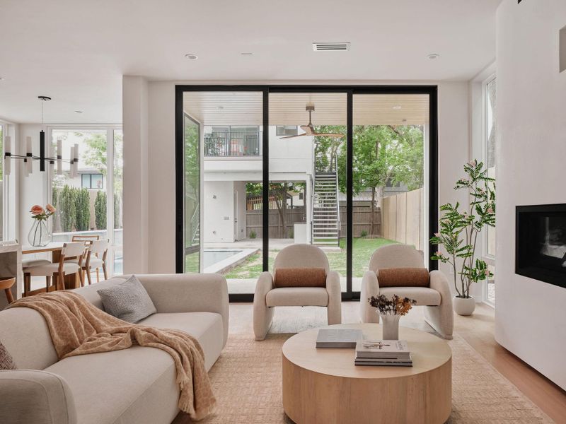 Living area with wood-finish flooring and a built-in fireplace