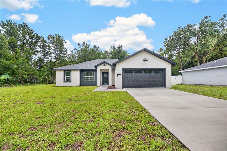 Front exterior of a new home in , Ocala, FL, highlighting curb appeal (Image 21).