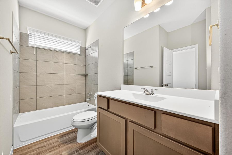 Furnished interior view inside a new home in Sunterra, Katy (Image 10).