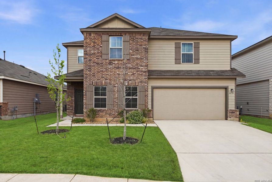 Front exterior of a new home in Winding Brook, San Antonio, TX, highlighting curb appeal (Image 22).