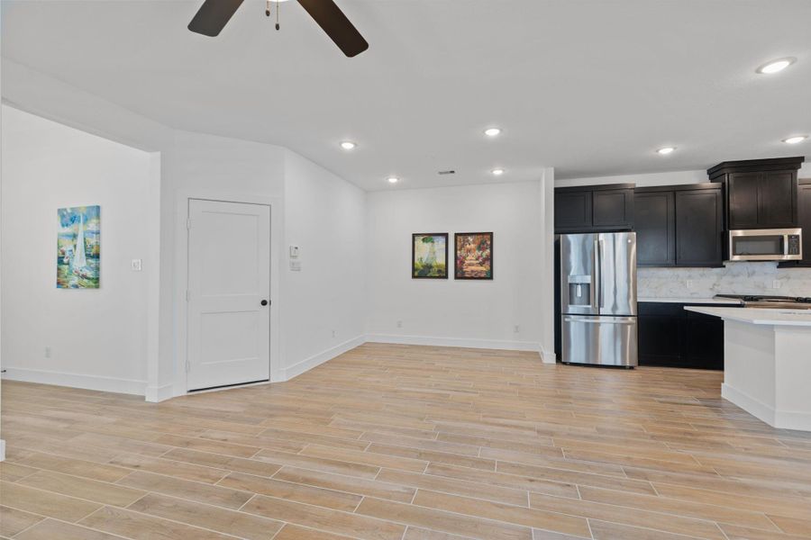 Dining area open to the island kitchen ready for you to enjoy.  The refrigerator is included.