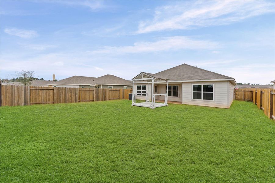 Oversized living area open to the kitchen and dining Oversized living area open to the kitchen and dining