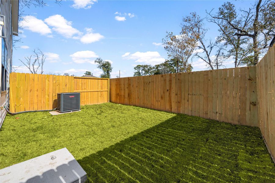 Fully fenced backyard featuring a grassy lawn and ample space for outdoor activities, pets, or future customization. Fully fenced backyard featuring a grassy lawn and ample space for outdoor activities, pets, or future customization.