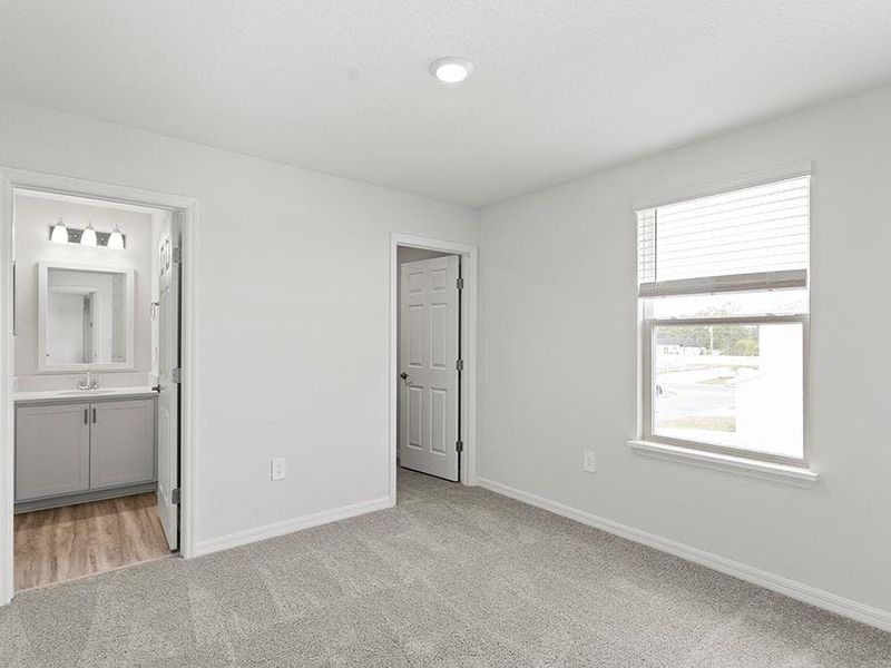 Bedrooms 2 and 3 share a Jack-and-Jill bath - Danyella bungalow by Highland Homes