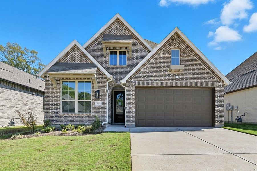 Front exterior of a new home in Gateway Village - The Reserve: 45ft. lots, Denison, TX, highlighting curb appeal (Image 1).