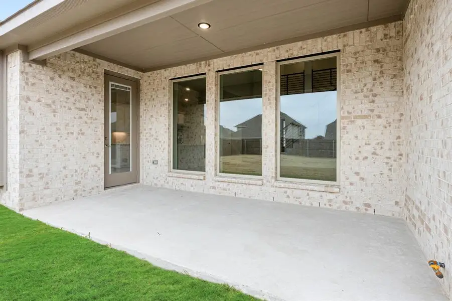 Exterior details and patio area of a home in Sunrise at Garden Valley, Waxahachie (Image 28).
