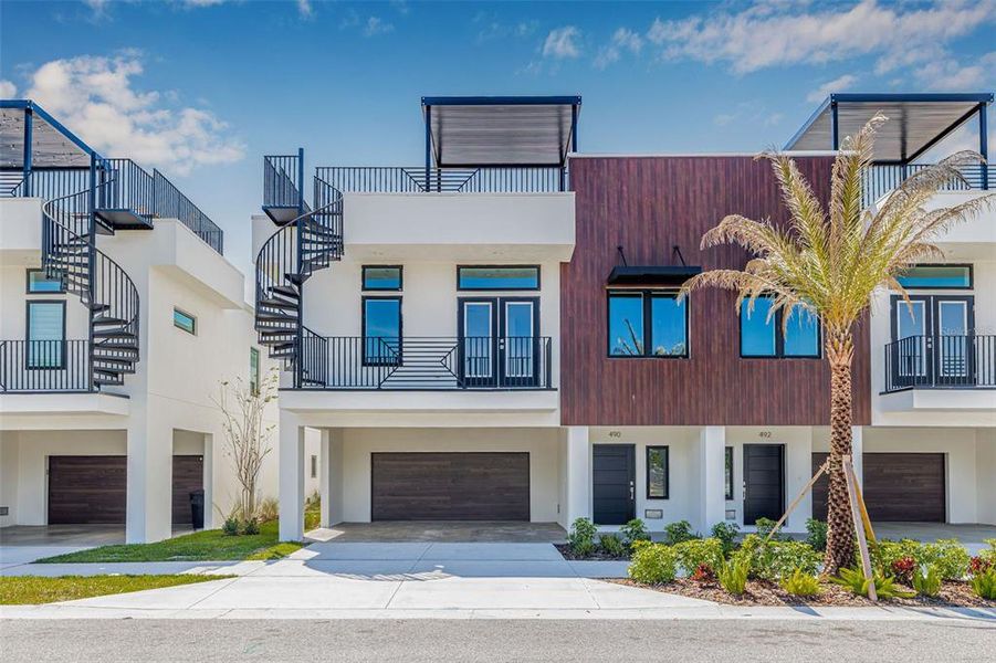 Front exterior of a new home in Terraces at 87th, St. Petersburg, FL, highlighting curb appeal (Image 22). Front exterior of a new home in Terraces at 87th, St. Petersburg, FL, highlighting curb appeal (Image 22).