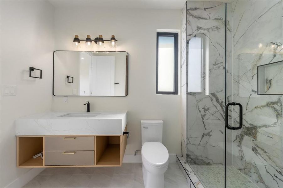 Full bathroom with vanity and a marble finish shower Full bathroom with vanity and a marble finish shower