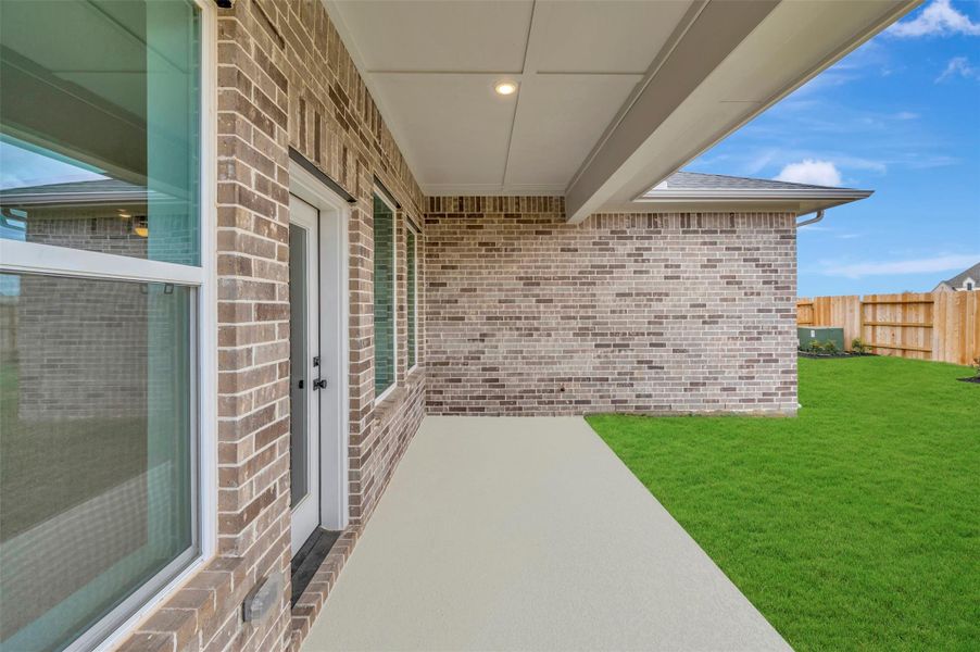 Exterior details and patio area of a home in The Grand Prairie - Retreat Collection, Hockley (Image 28).