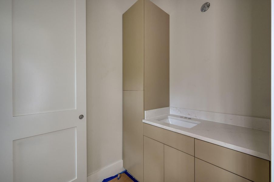 The other side of the Hollywood bathroom featuring custom built in storage and under counter storage.
