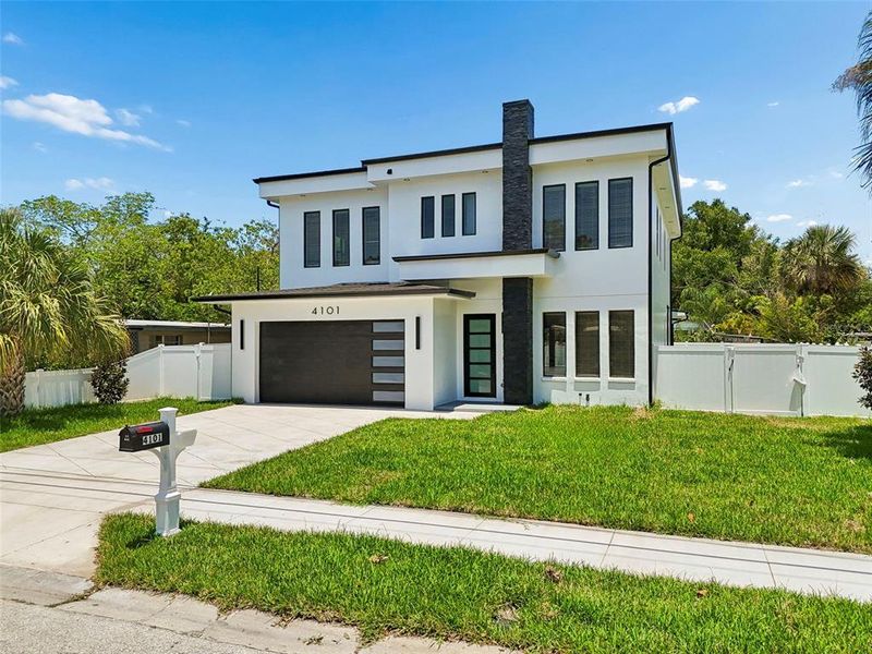 Front exterior of a new home in , Tampa, FL, highlighting curb appeal (Image 30).