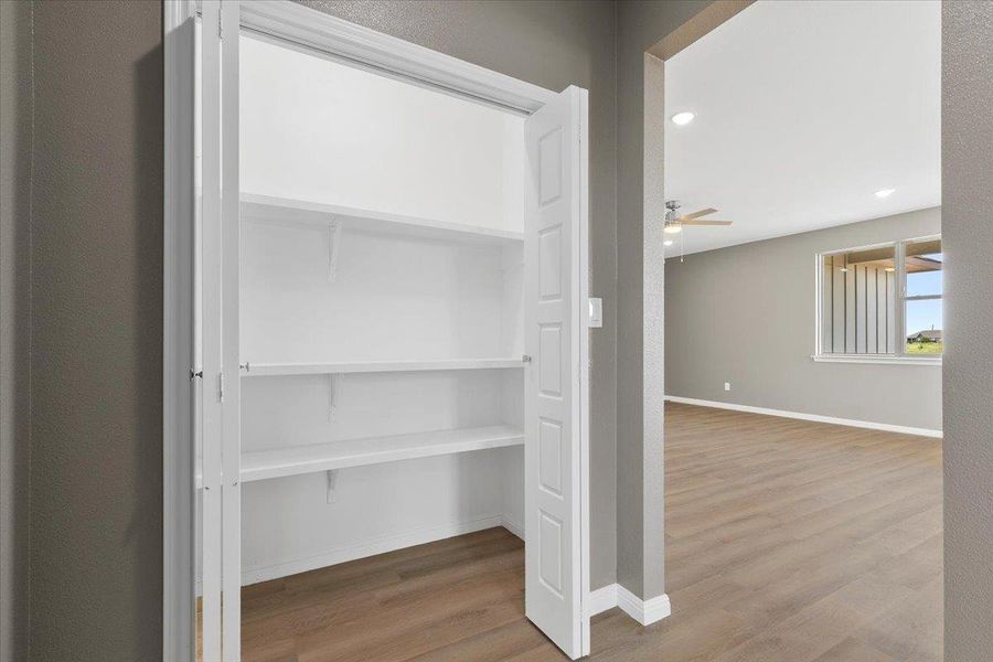 pantry offers ample storage, complementing the open floorplan's spacious feel. pantry offers ample storage, complementing the open floorplan's spacious feel.