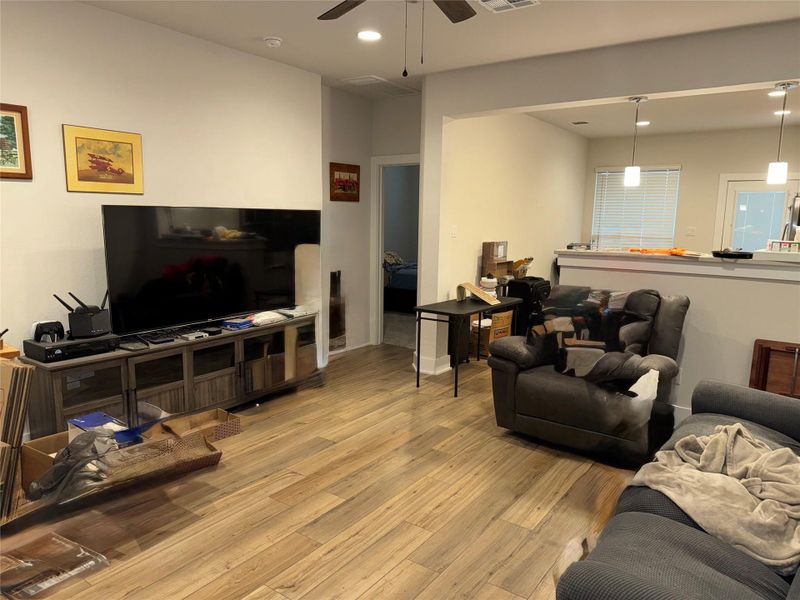 Living room featuring recessed lighting, wood finished floors, and a ceiling fan