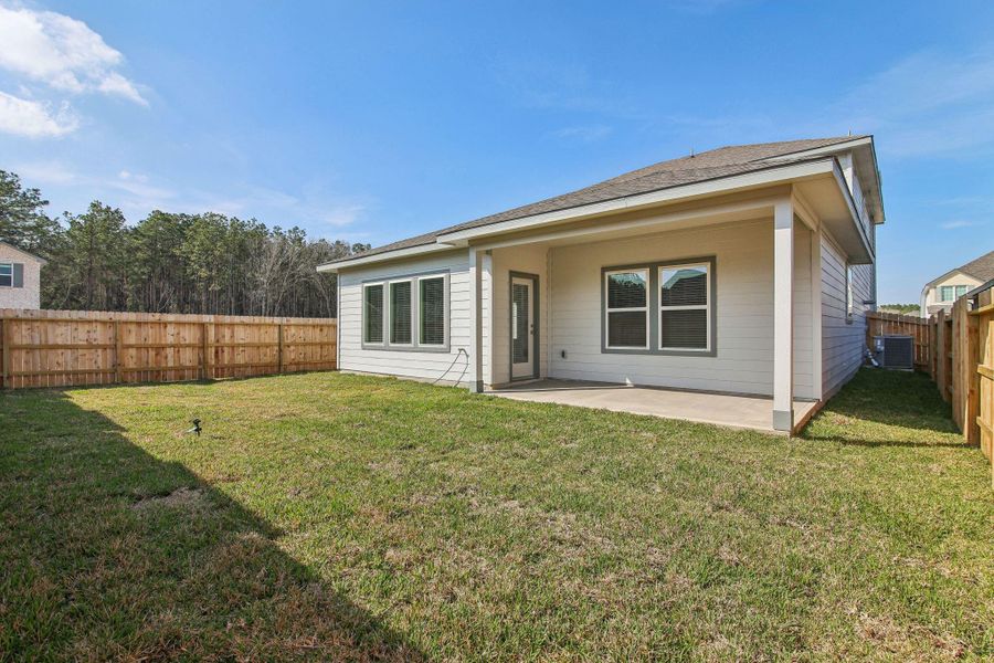 Exterior details and patio area of a home in Landing Meadows - Premier Series, New Caney (Image 17).