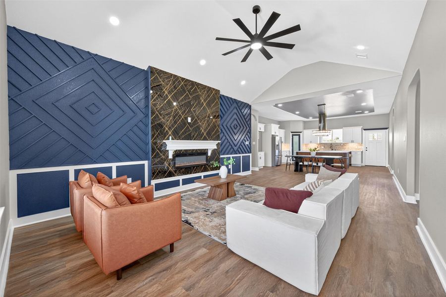 Open-concept living area centered around a fireplace and designed for everyday living and entertaining. Open-concept living area centered around a fireplace and designed for everyday living and entertaining.