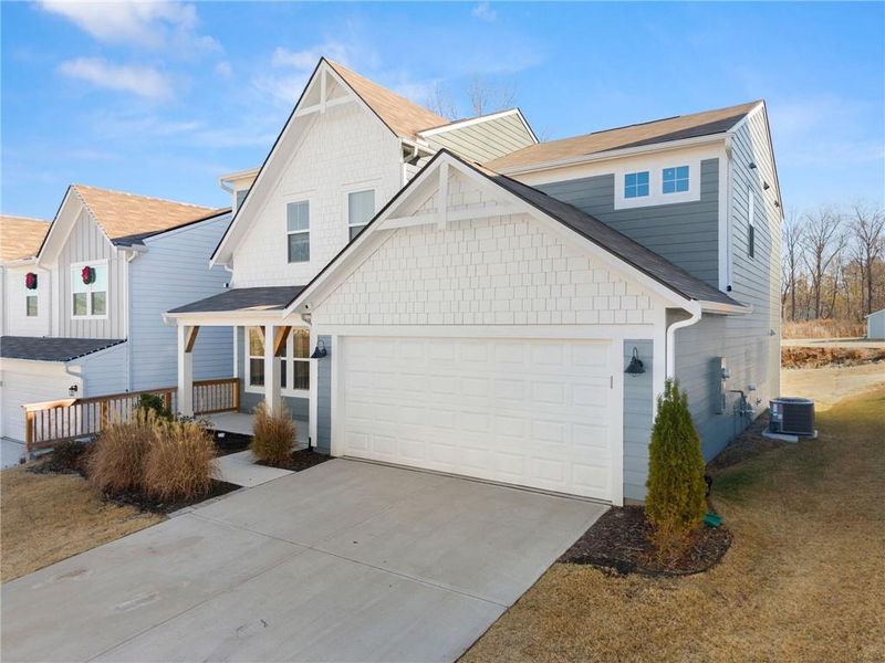 Front exterior of a new home in , Braselton, GA, highlighting curb appeal (Image 2). Front exterior of a new home in , Braselton, GA, highlighting curb appeal (Image 2).