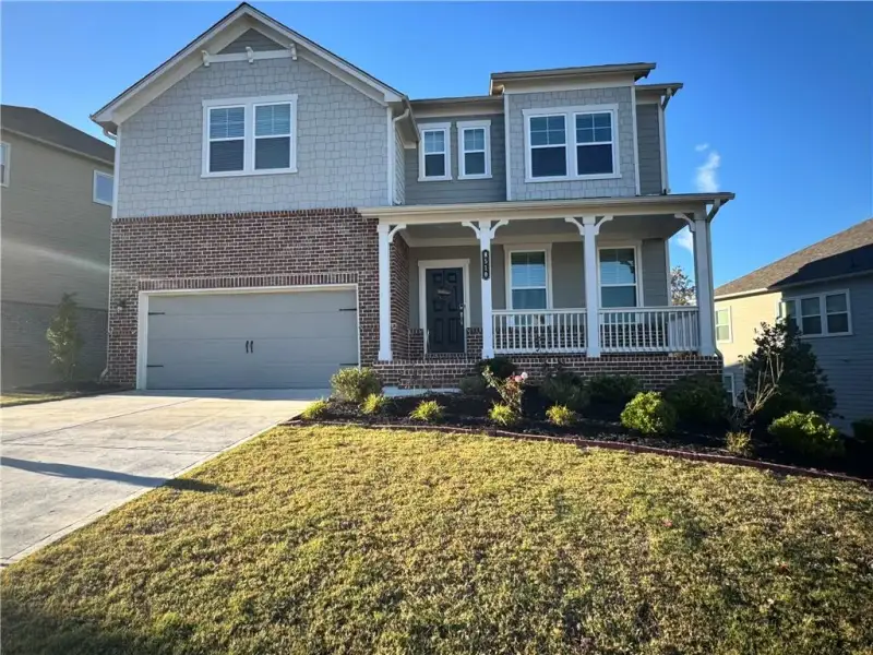 Front exterior of a new home in Stratford Hills, Ball Ground, GA, highlighting curb appeal (Image 2). Front exterior of a new home in Stratford Hills, Ball Ground, GA, highlighting curb appeal (Image 2).