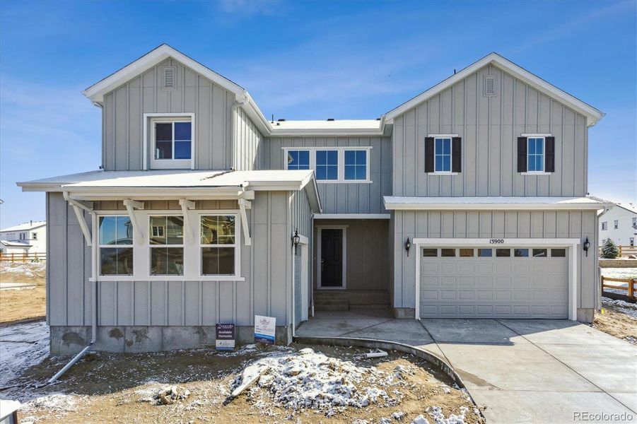 Front exterior of a new home in Trails at Smoky Hill, Parker, CO, highlighting curb appeal (Image 2).
