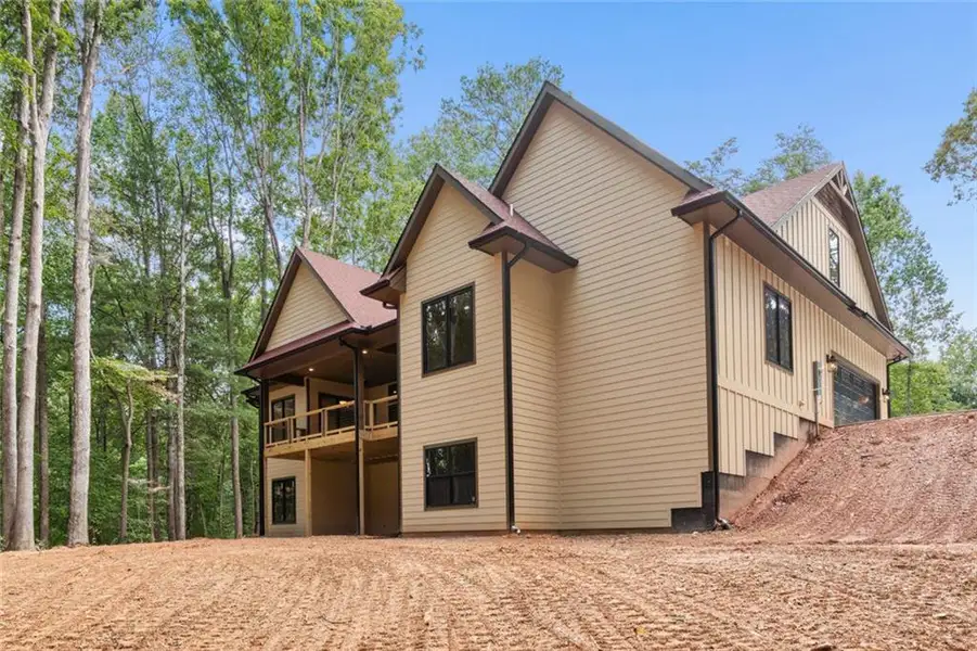 Front exterior of a new home in , Dawsonville, GA, highlighting curb appeal (Image 2). Front exterior of a new home in , Dawsonville, GA, highlighting curb appeal (Image 2).