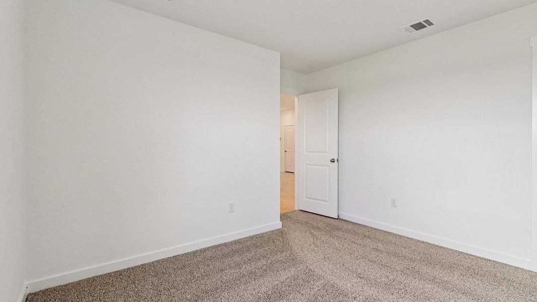 Spacious, unfurnished interior of a new home in Monarch Ranch, Manor (Image 24).