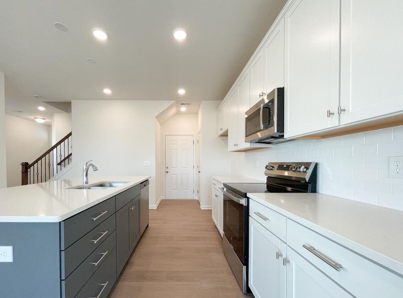 Furnished interior view inside a new home in Bellevue Townhomes, Greenville (Image 7).