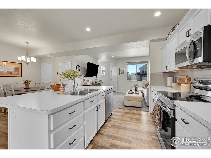 Kitchen with Island and Stainless Steel appliances