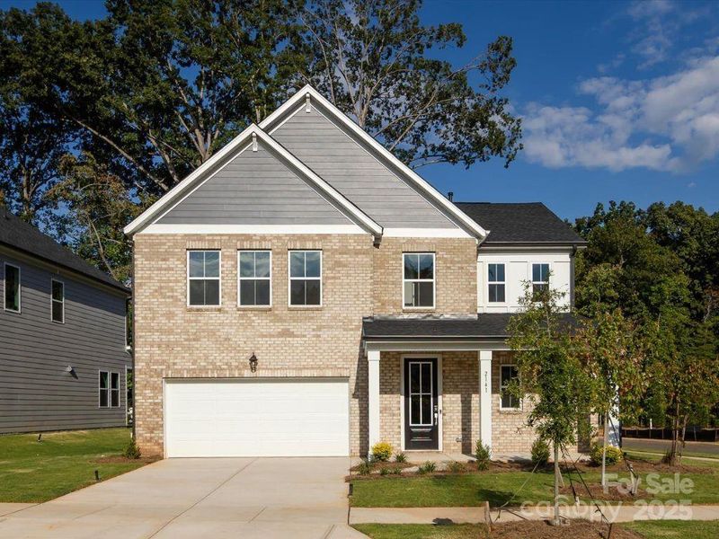 Corner lot with front load 2-bay garage.