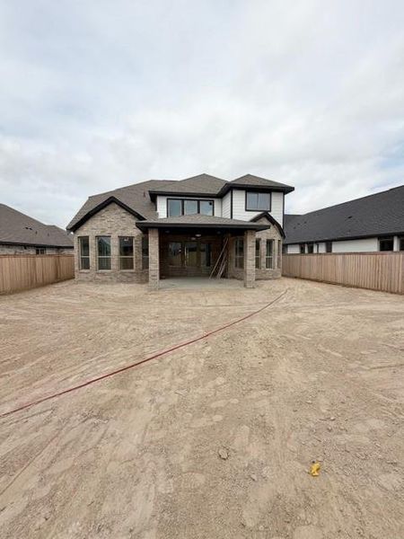 Exterior details and patio area of a home in Bridgeland, Cypress (Image 4).