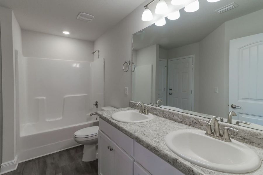 Furnished interior view inside a new home in Pecan Valley, Cantonment (Image 7). Furnished interior view inside a new home in Pecan Valley, Cantonment (Image 7).