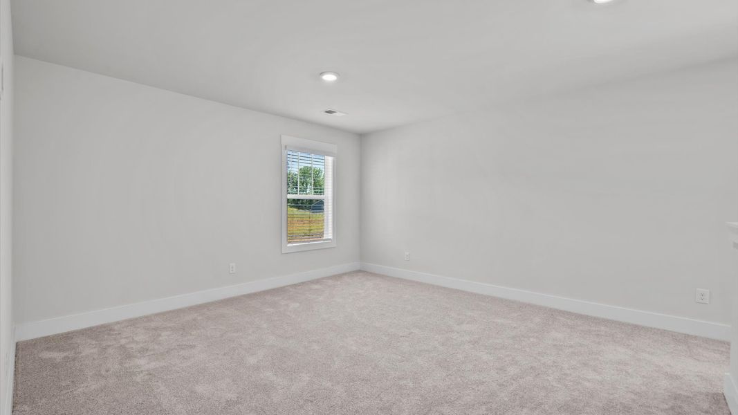 Representative furnished interior of a home built from the Jasmine by DRB Homes in Harrier Point, Woodruff (Image 12).