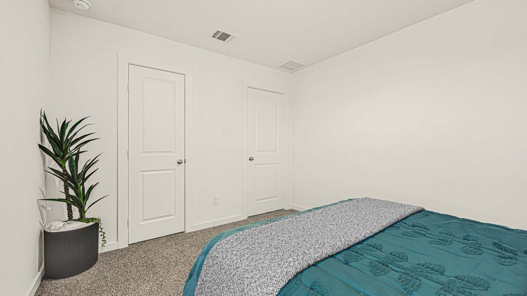 Representative furnished interior of a home built from the Jasmine by D.R. Horton in Holly Ridge, Rosenberg (Image 25).