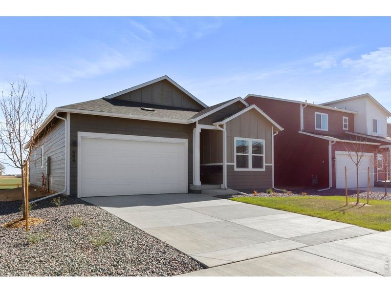 Front exterior of a new home in Granary, Johnstown, CO, highlighting curb appeal (Image 15).