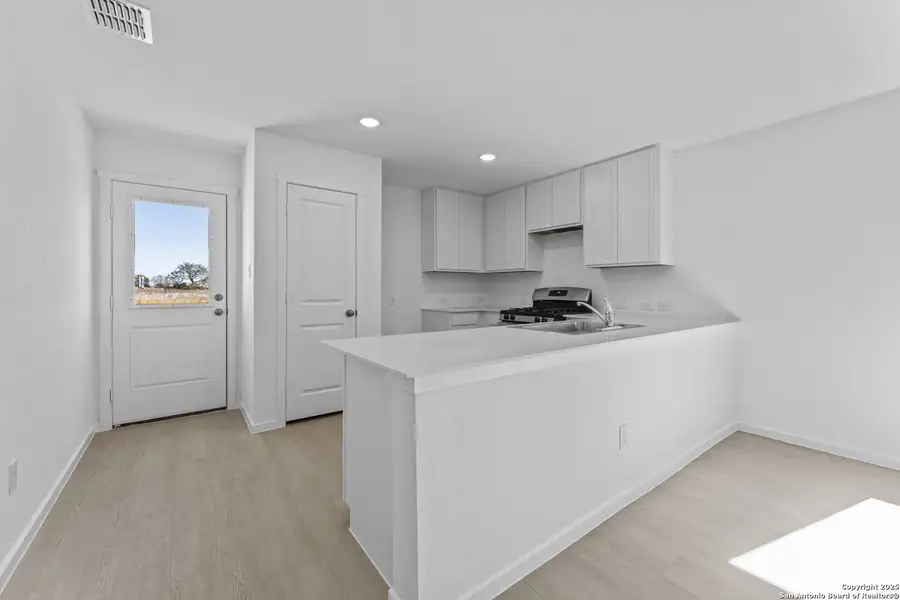 Furnished interior view inside a new home in Randolph Crossing: Cottage Collection, Converse (Image 4).