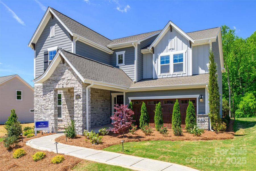 Front exterior of a new home in North Creek Village, Huntersville, NC, highlighting curb appeal (Image 18).