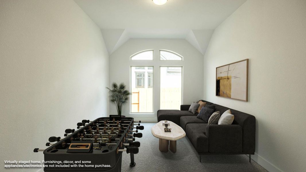 Game room featuring carpet floors and lofted ceiling