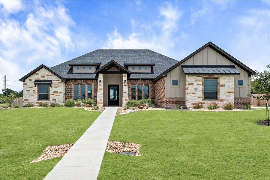 An inviting stone and brick façade welcomes you to this attractive single-story residence with a manicured front lawn. An inviting stone and brick façade welcomes you to this attractive single-story residence with a manicured front lawn.