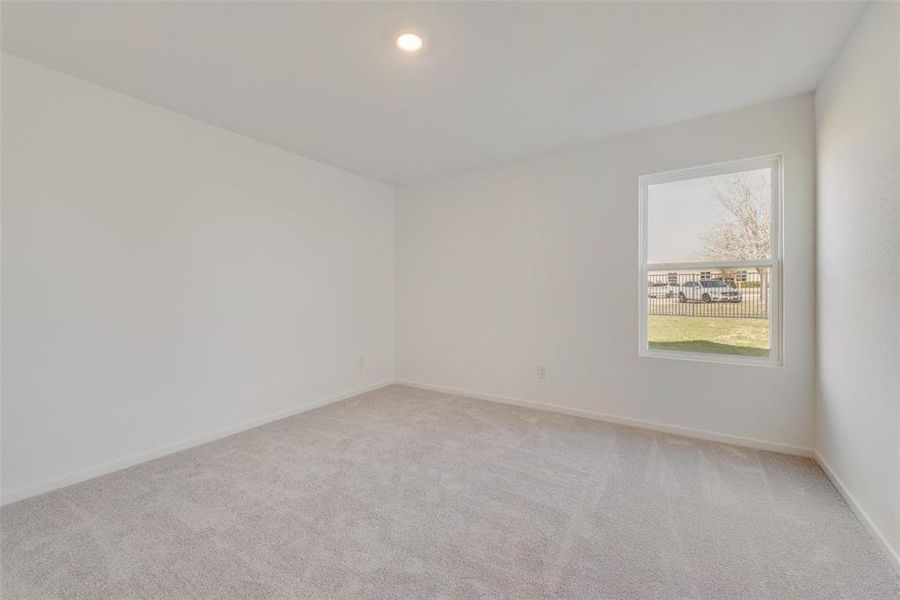 Unfurnished room with light colored carpet