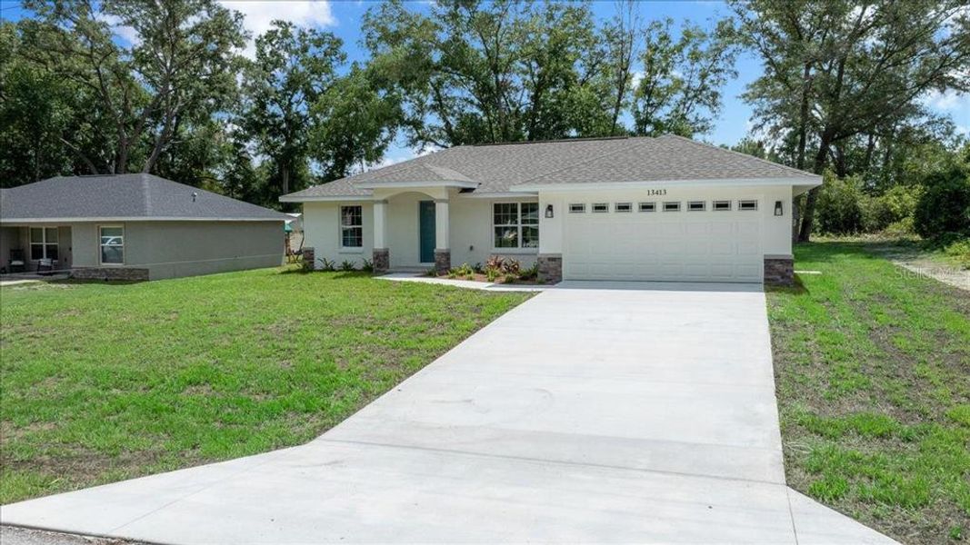 Front exterior of a new home in , Belleview, FL, highlighting curb appeal (Image 20).
