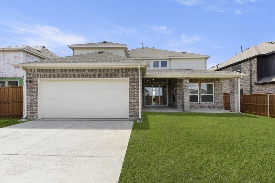 Front exterior of a new home in Villages of Creekwood, Frisco, TX, highlighting curb appeal (Image 2). Front exterior of a new home in Villages of Creekwood, Frisco, TX, highlighting curb appeal (Image 2).