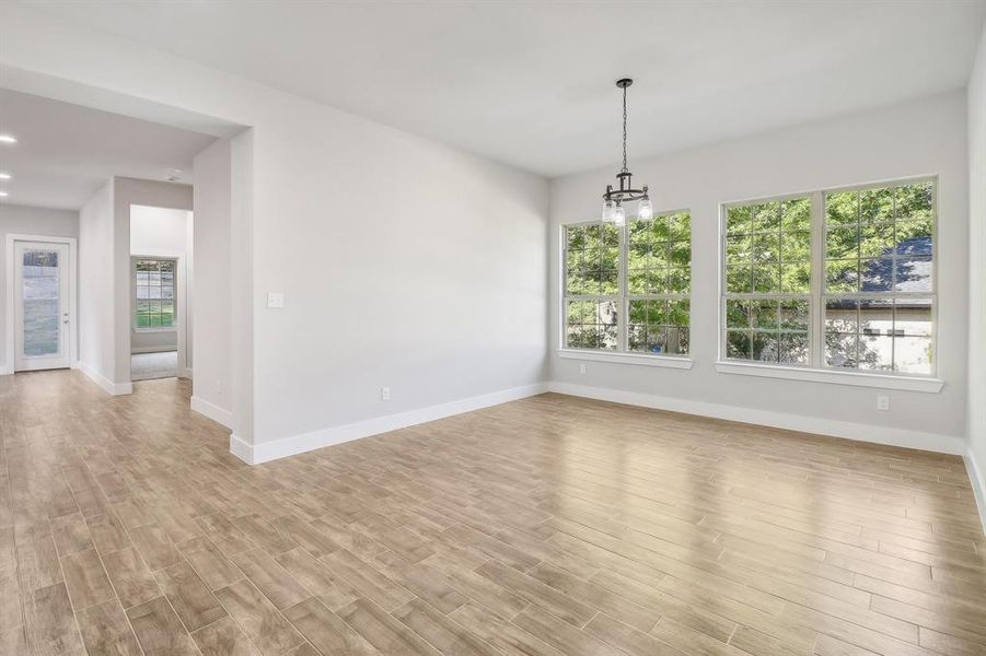 Spare room with light wood-type flooring and plenty of natural light