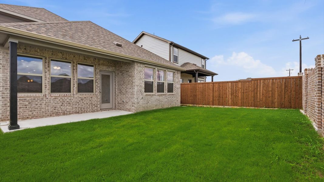 Exterior details and patio area of a home in Westridge Journey, Princeton (Image 25).
