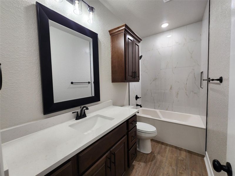 A well-appointed bathroom with a spacious vanity and sleek tub-shower combination. A well-appointed bathroom with a spacious vanity and sleek tub-shower combination.