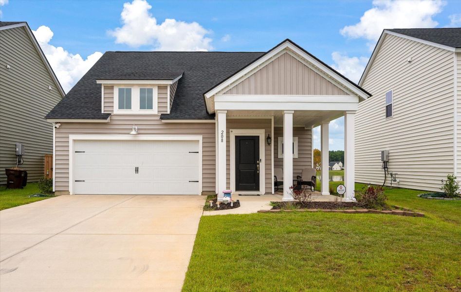 Front exterior of a new home in Cypress Preserve, Moncks Corner, SC, highlighting curb appeal (Image 23). Front exterior of a new home in Cypress Preserve, Moncks Corner, SC, highlighting curb appeal (Image 23).