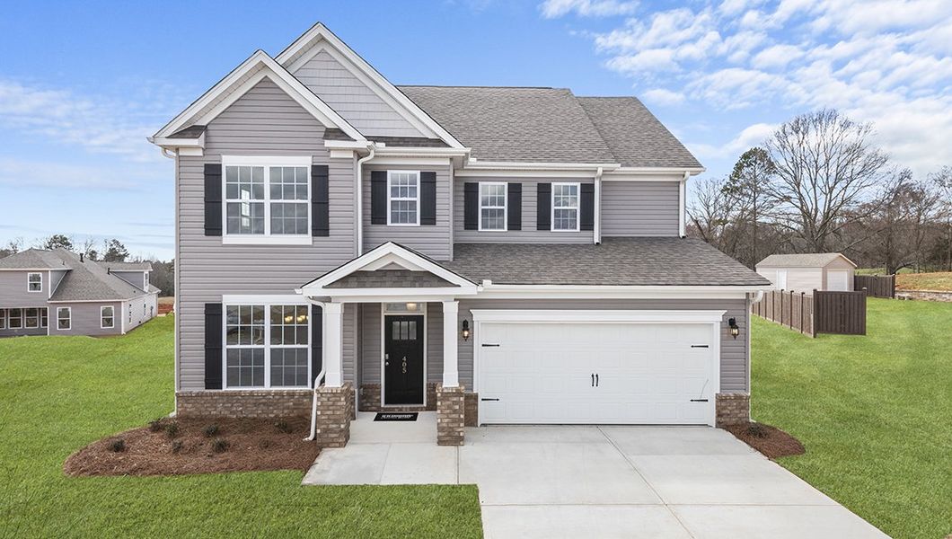 Front exterior of a new home in Reserve at Tap Root Farms, Fletcher, NC, highlighting curb appeal (Image 1). Front exterior of a new home in Reserve at Tap Root Farms, Fletcher, NC, highlighting curb appeal (Image 1).