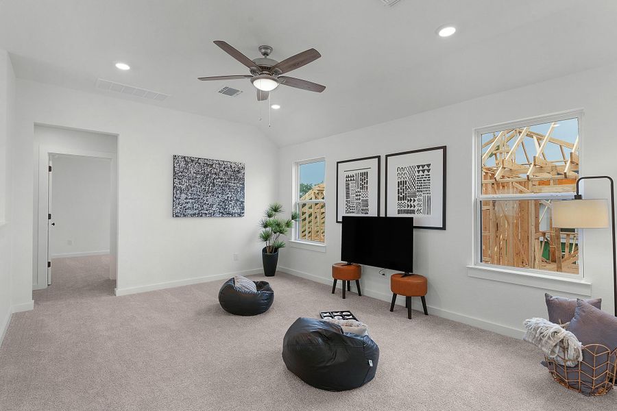 Living area with ceiling fan, carpet, baseboards, vaulted ceiling, and recessed lighting