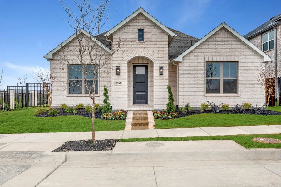 Front exterior of a new home in Talia – Garden Series, Mesquite, TX, highlighting curb appeal (Image 1). Front exterior of a new home in Talia – Garden Series, Mesquite, TX, highlighting curb appeal (Image 1).