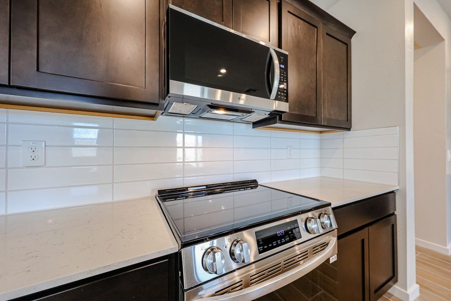 A kitchen with stainless steel appliances. A kitchen with stainless steel appliances.