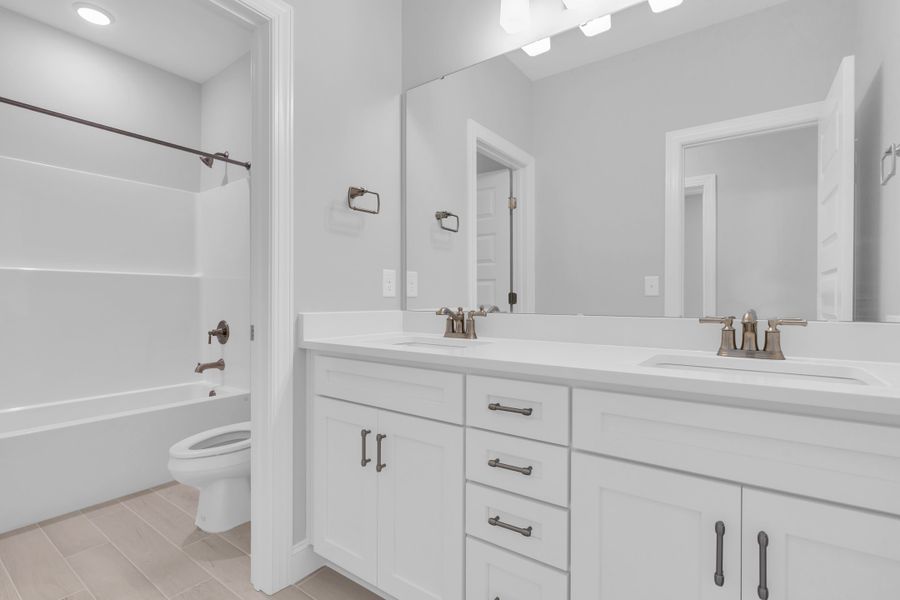 Representative furnished interior of a home built from the The Hampton by RobuckHomes in Windwater, Hampstead (Image 50).