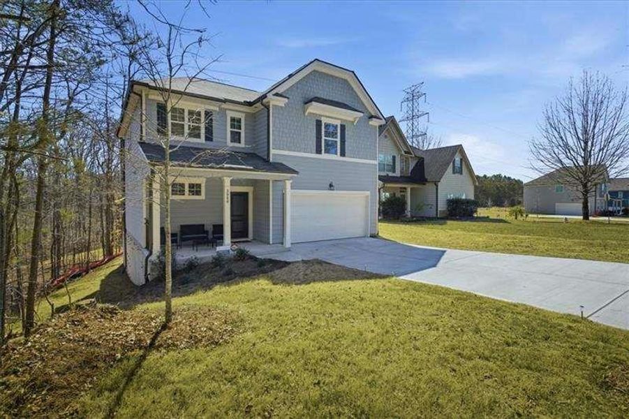 Front exterior of a new home in Tell River, Atlanta, GA, highlighting curb appeal (Image 2). Front exterior of a new home in Tell River, Atlanta, GA, highlighting curb appeal (Image 2).